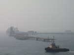 SX03448 Oil tanker in the mist and tug boat.jpg